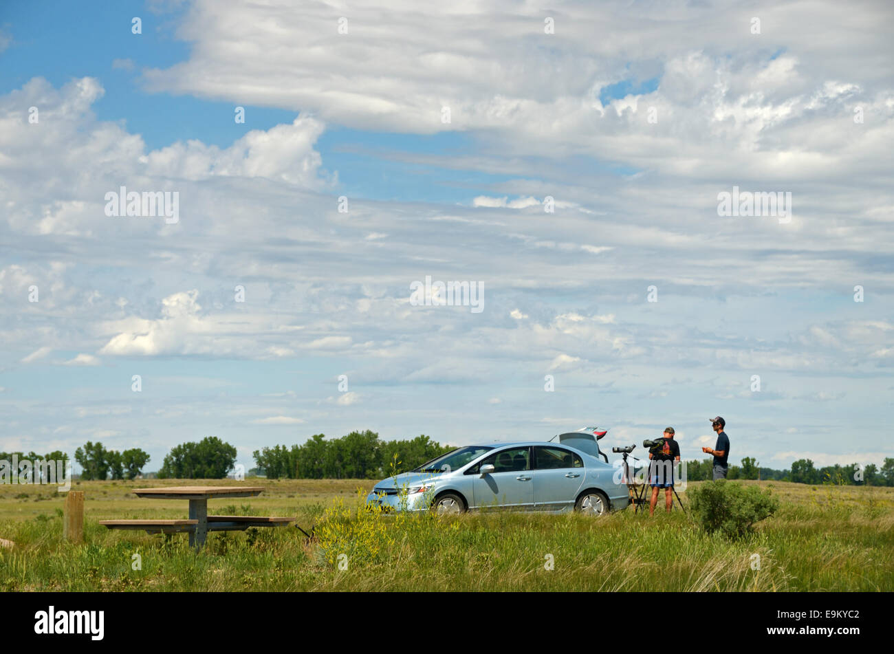 Visitors with spotting scopes at Buffalo Camp in the American Prairie Reserve. South of Malta, Montana. Stock Photo