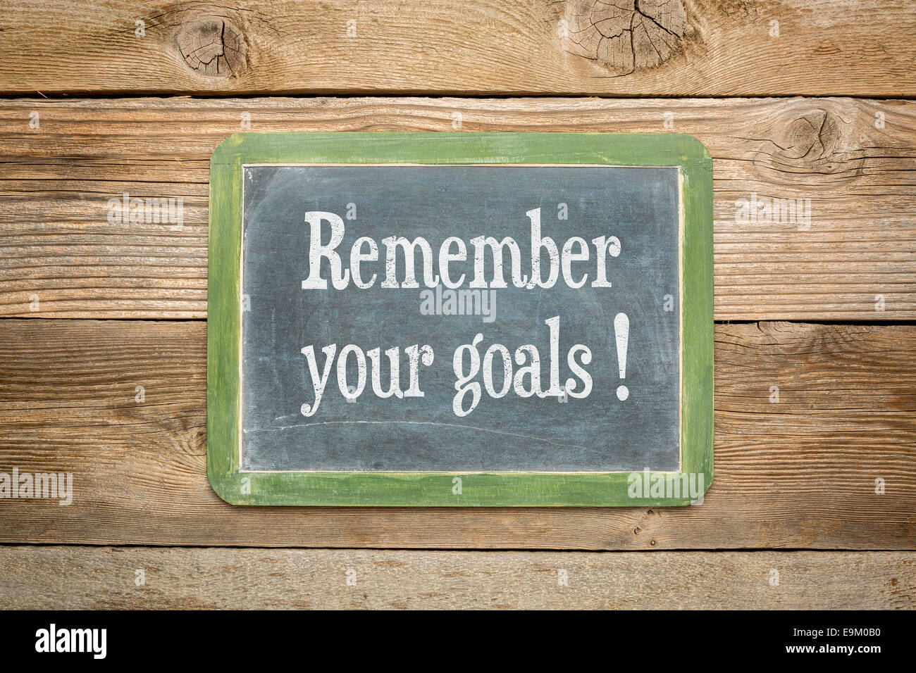remember your goals reminder on a  slate blackboard against rustic weathered wood planks Stock Photo