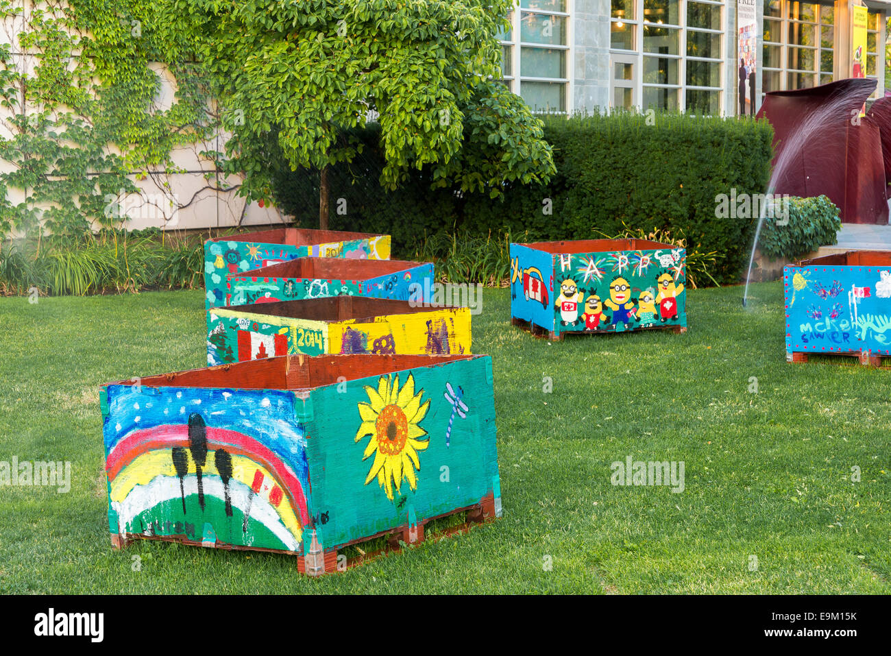 Painted fruit crates, decorate the lawn outside the Kelowna Art Gallery, Kelowna, British Columbia, Canada Stock Photo