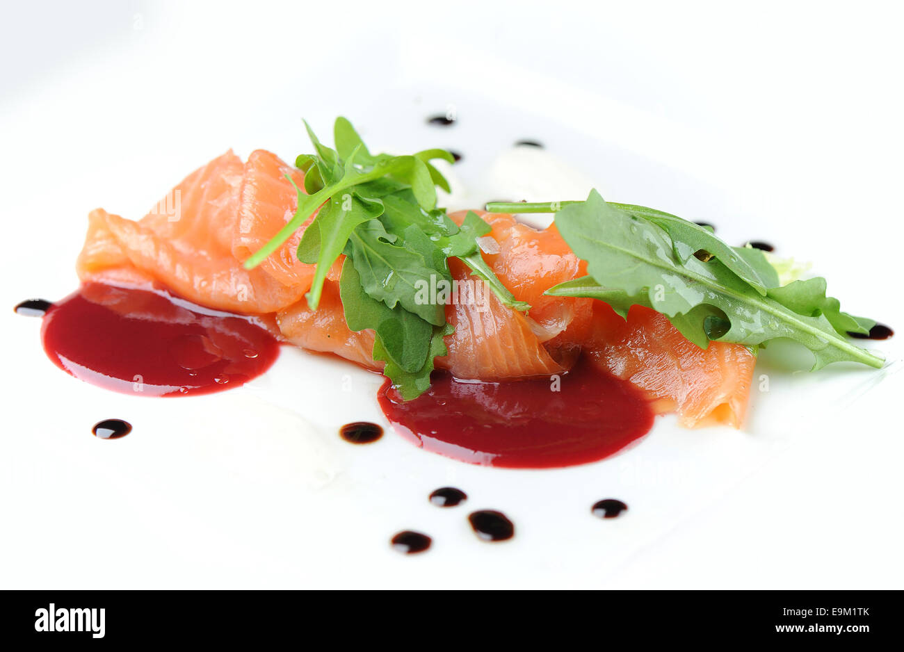 Smoked Salmon Gravlax Served As A Starter On A White Plate With Chilli Sauce Stock Photo Alamy