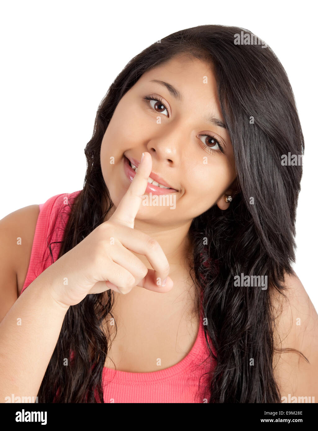 portrait of a young woman with finger on her lips Stock Photo