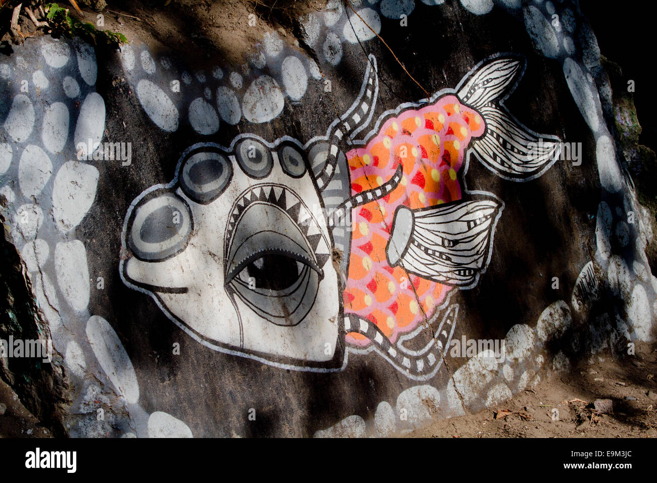 Graffiti street art Berlin Wall cartoon fish colour Stock Photo