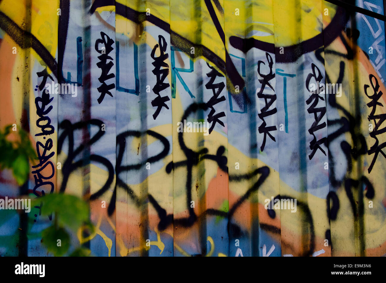 Graffiti street art Berlin Wall colour tags urban Stock Photo