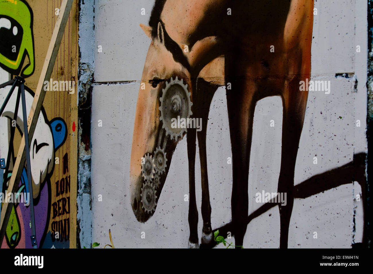Graffiti street art Berlin Wall colour horse pipe Stock Photo
