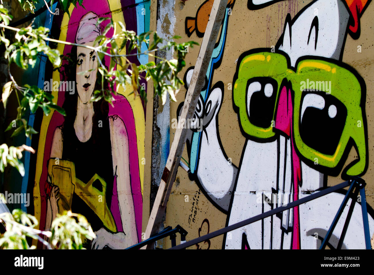 Graffiti street art Berlin Wall colour cartoon Stock Photo