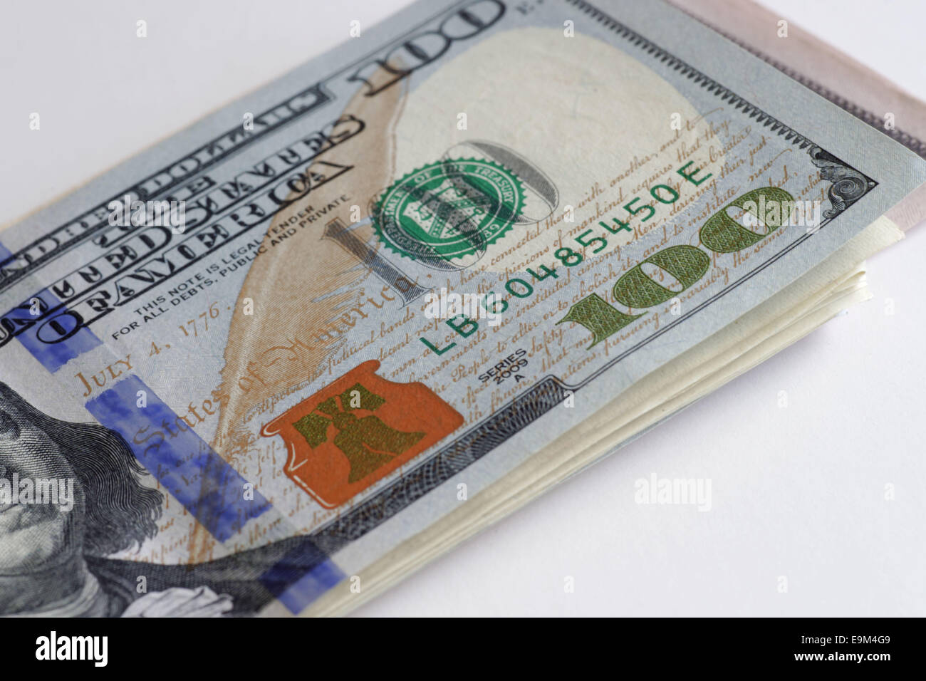 money, $100 bills, close-up of stack of money, US dollars, hundred us dollar bills white background. Stock Photo