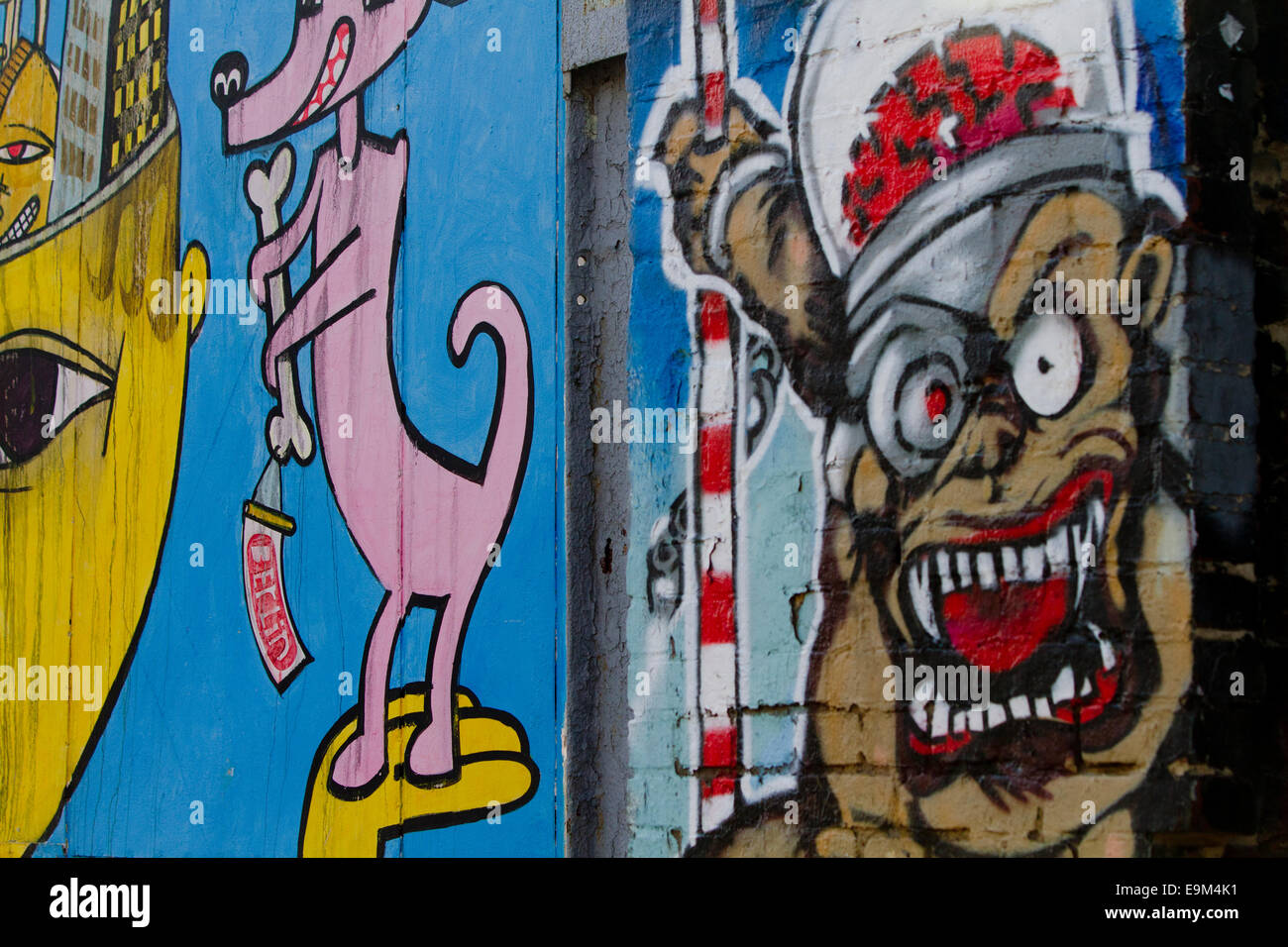 Graffiti street art Berlin Wall cartoon gallery Stock Photo