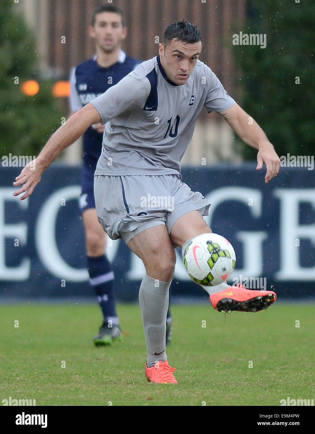 Washington, DC, USA. 29th Oct, 2014. Georgetown forward Brandon Allen (10) passes against Xavier in the second half at Shaw Field in Washington. Georgetown defeated Xavier in overtime, 1-0. Credit:  Chuck Myers/ZUMA Wire/Alamy Live News Stock Photo