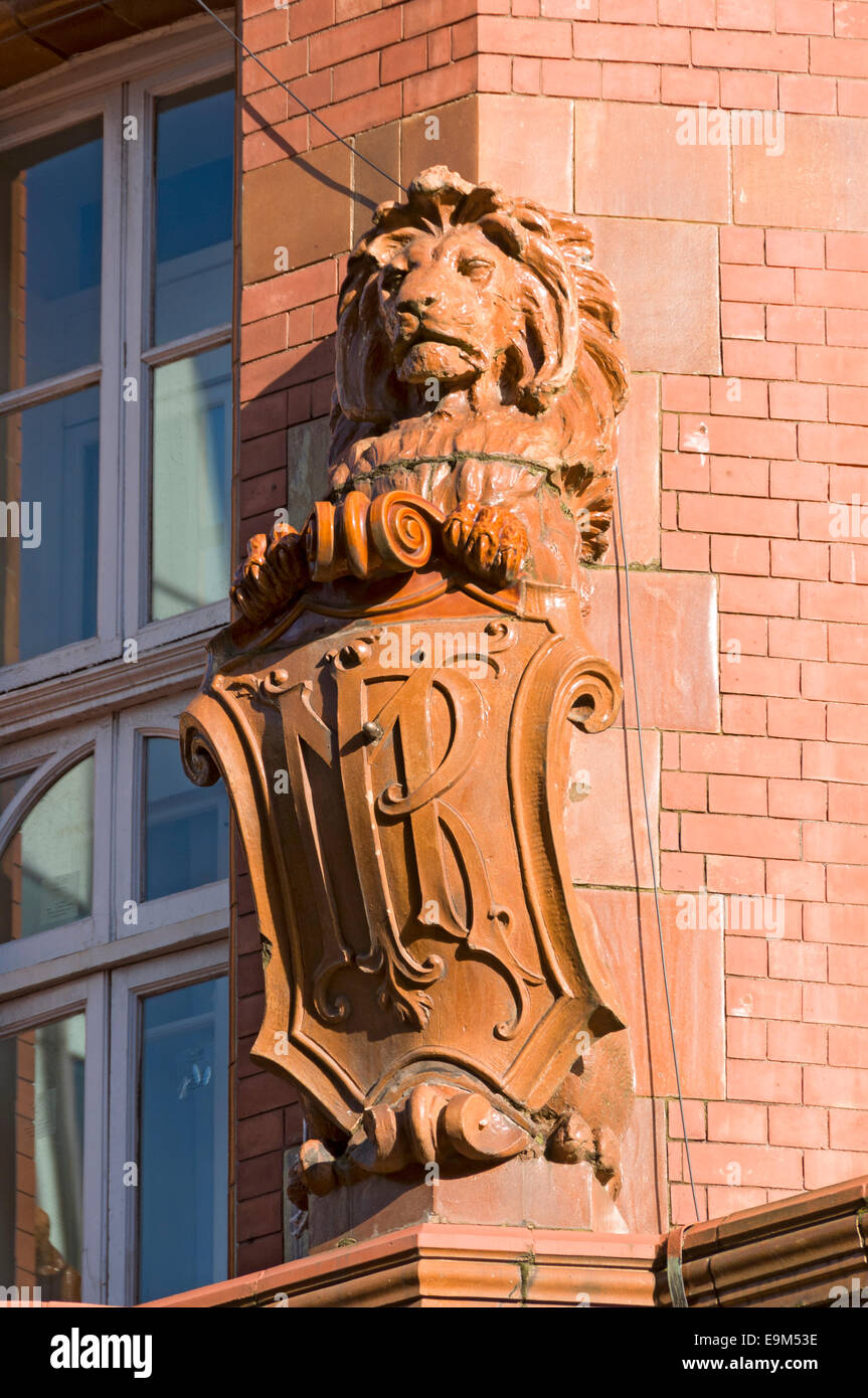 Terracotta lion with shield on the corner of the Midland Hotel.  Mount Street, Manchester, England, UK. Stock Photo