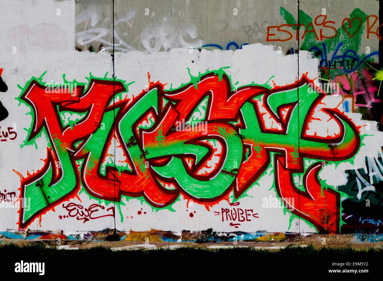 Berlin Wall Graffiti cartoon colourful flesh word Stock Photo