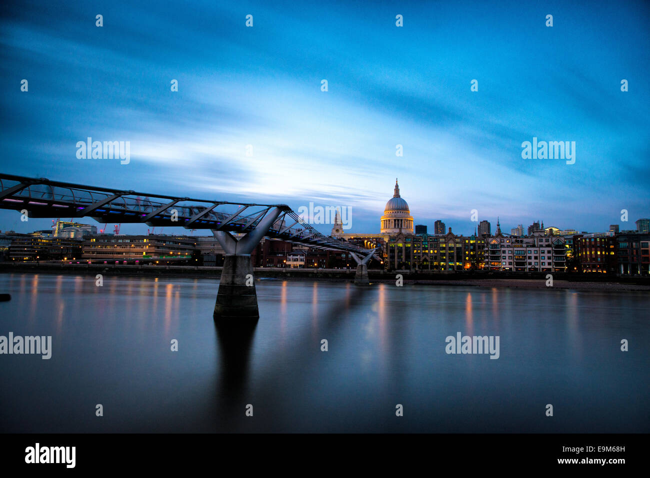 LONDON, UK - The Thames, with the Millennial Bridge and the dome of St Paul's Cathedral in London at dusk. London, United Kingdom. Stock Photo
