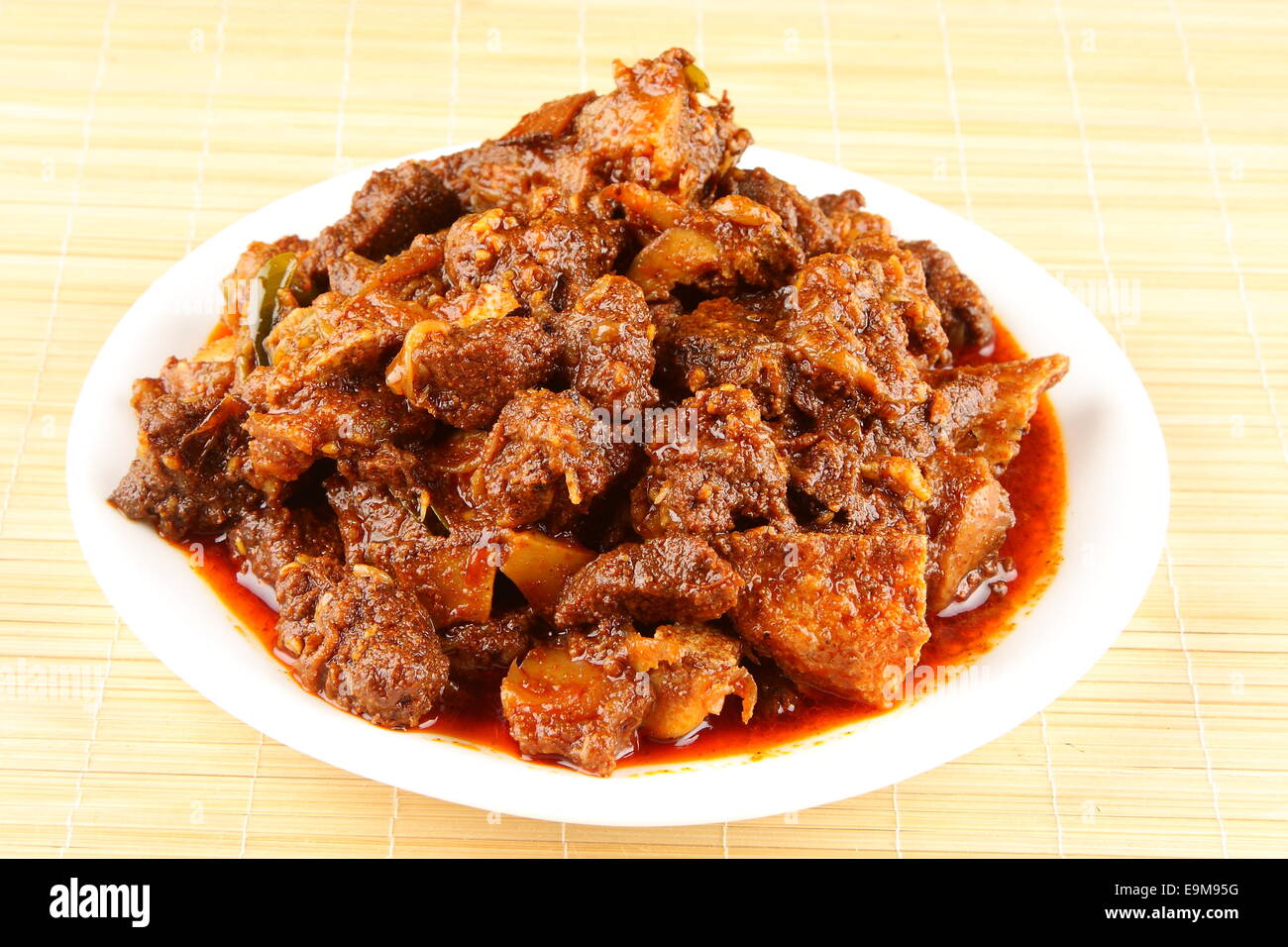 mutton curry.delicious Kerala style meat curry. It goes well well with ghee rice, appam, parotta, puttu and chappathi. Stock Photo