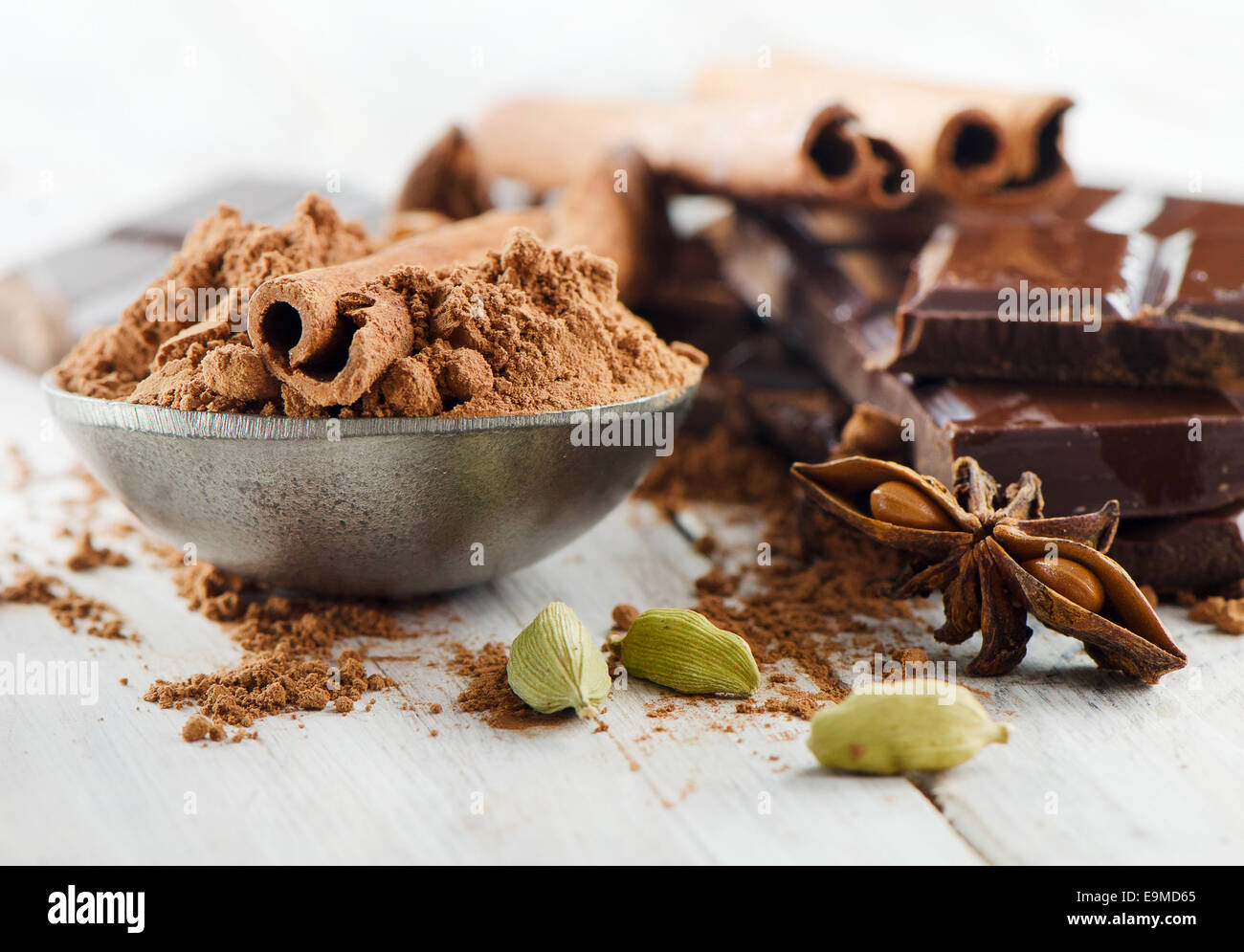 Broken chocolate bar and spices . Selective focus Stock Photo