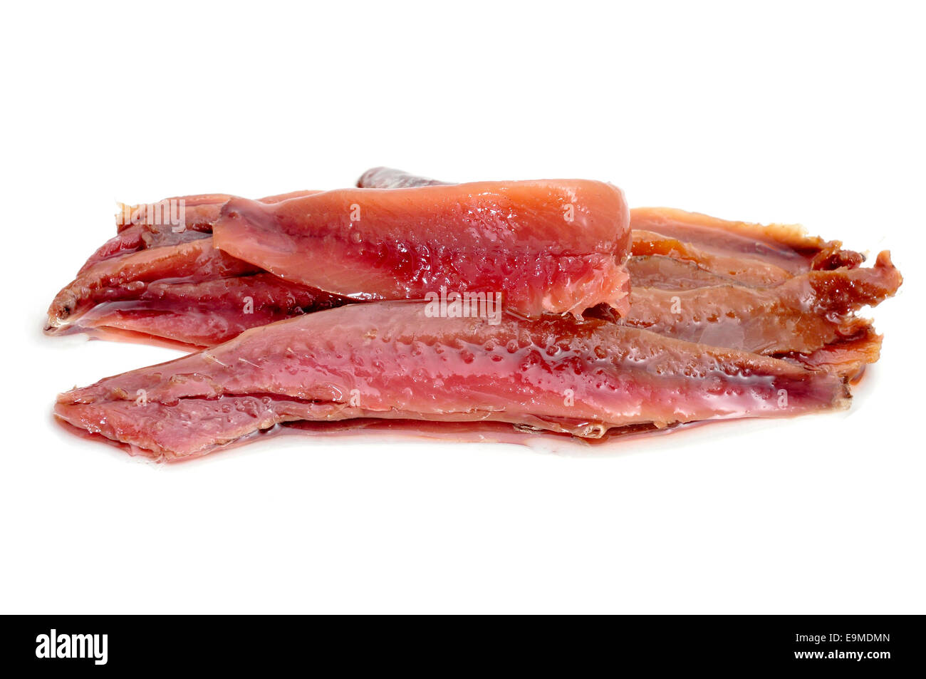 some marinated anchovy fillets on a white background Stock Photo