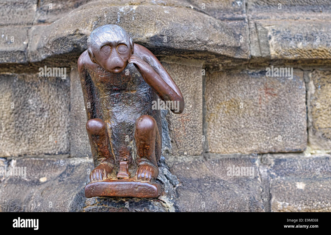 A several centuries old statue of monkey on Grand Place of Mons