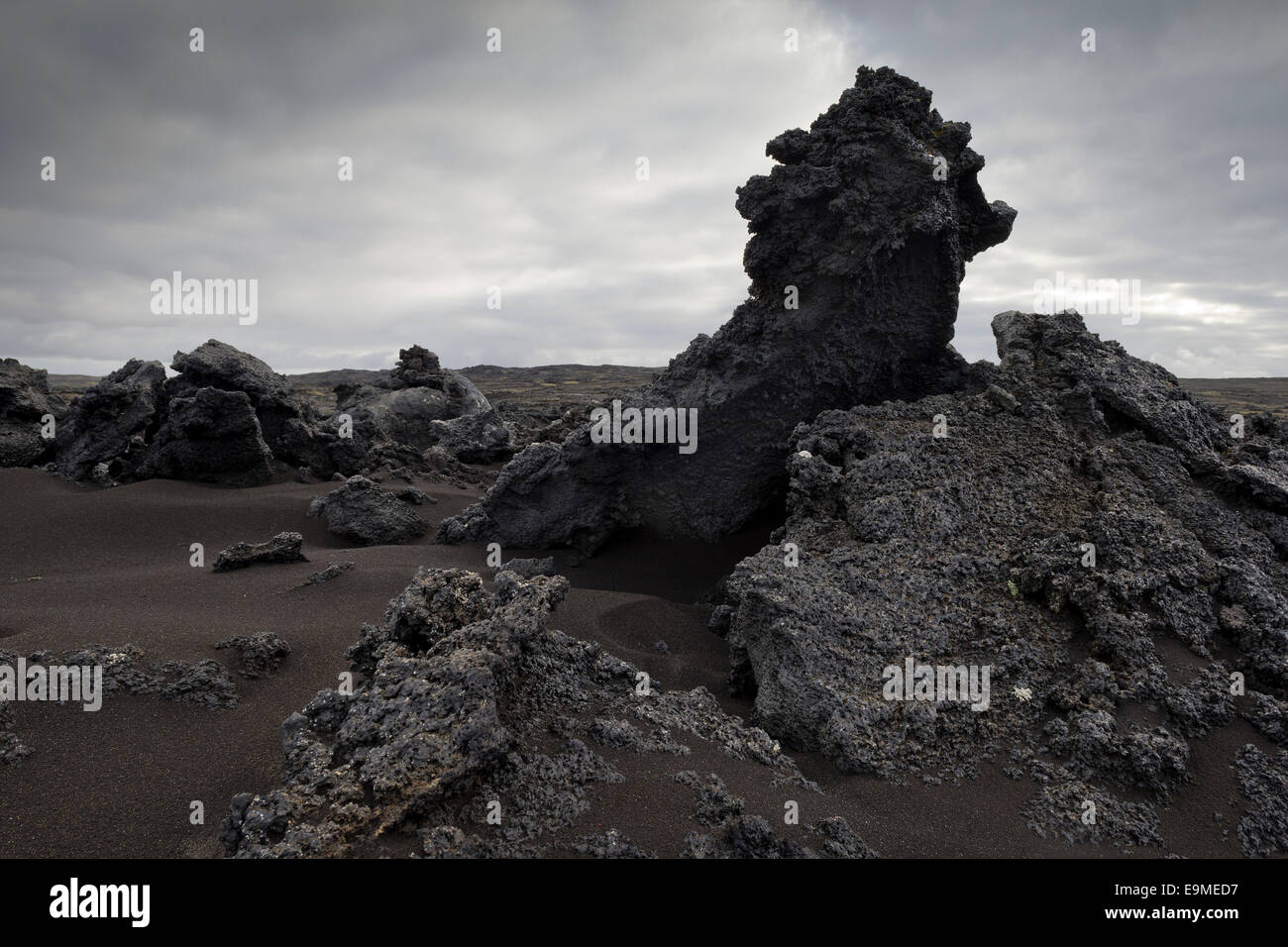 Black sand and piled up lava, Reykjanesskagi, Southern Peninsula or Reykjanes, Iceland Stock Photo
