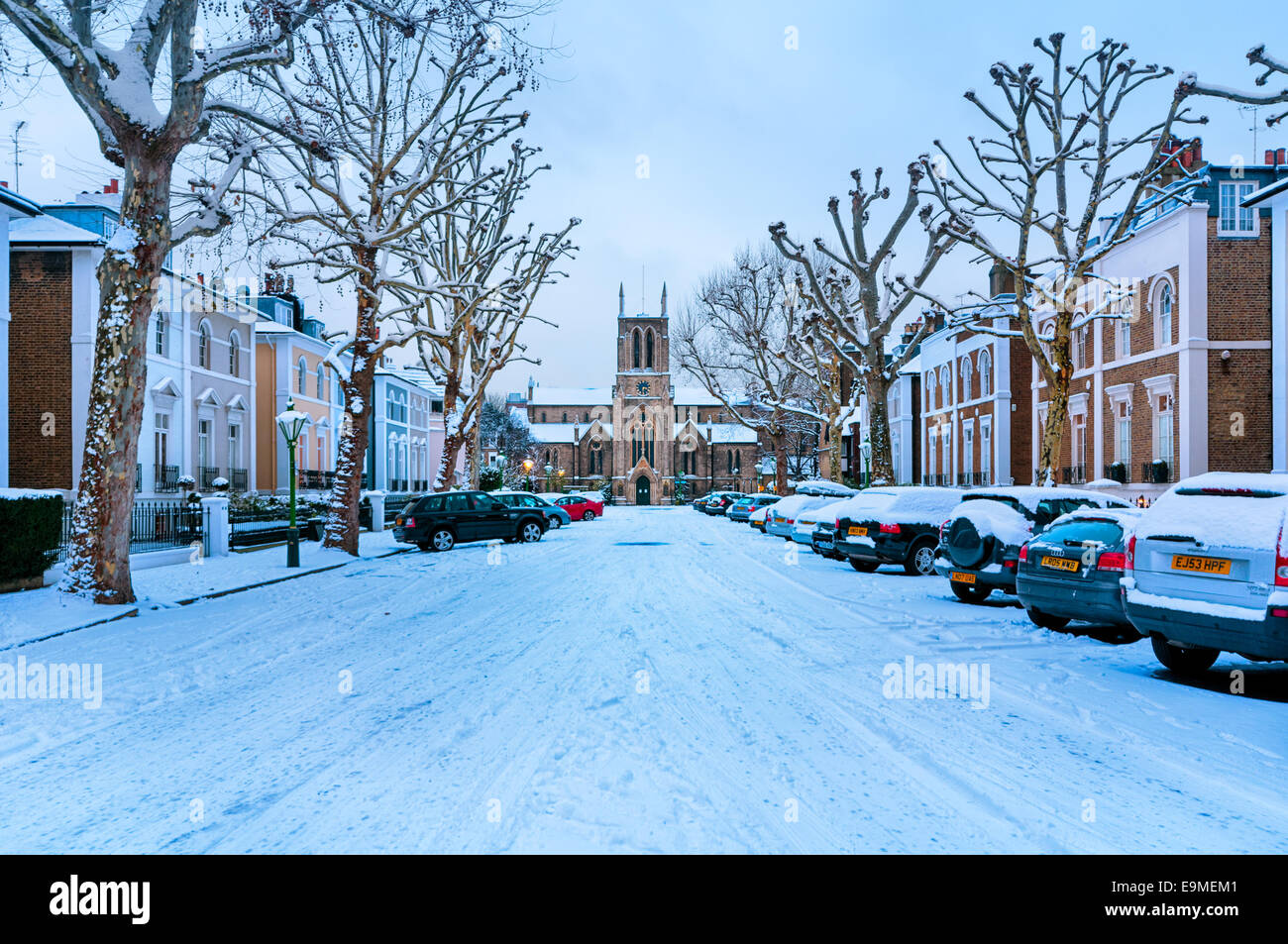 Snow covered, cosy street in Holland Park, London. (St James’s Church in the middle.) Stock Photo