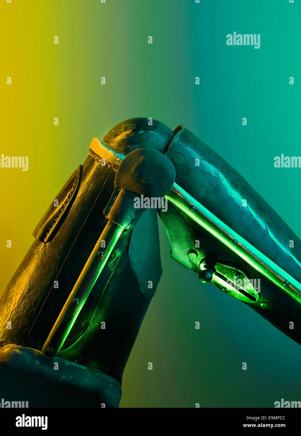 Cropped image of robotic limb against colored background Stock Photo