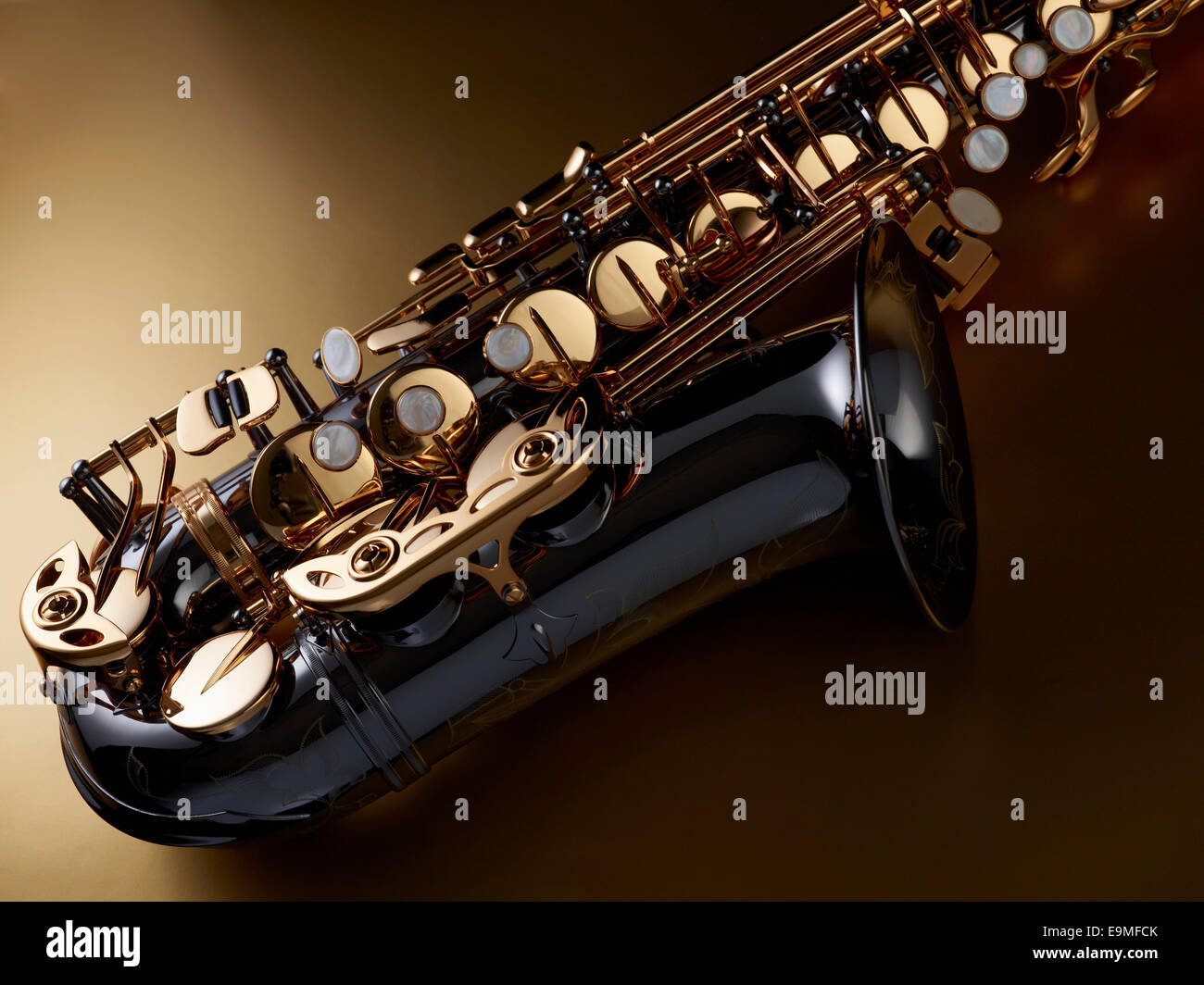 High angle view of saxophone against colored background Stock Photo