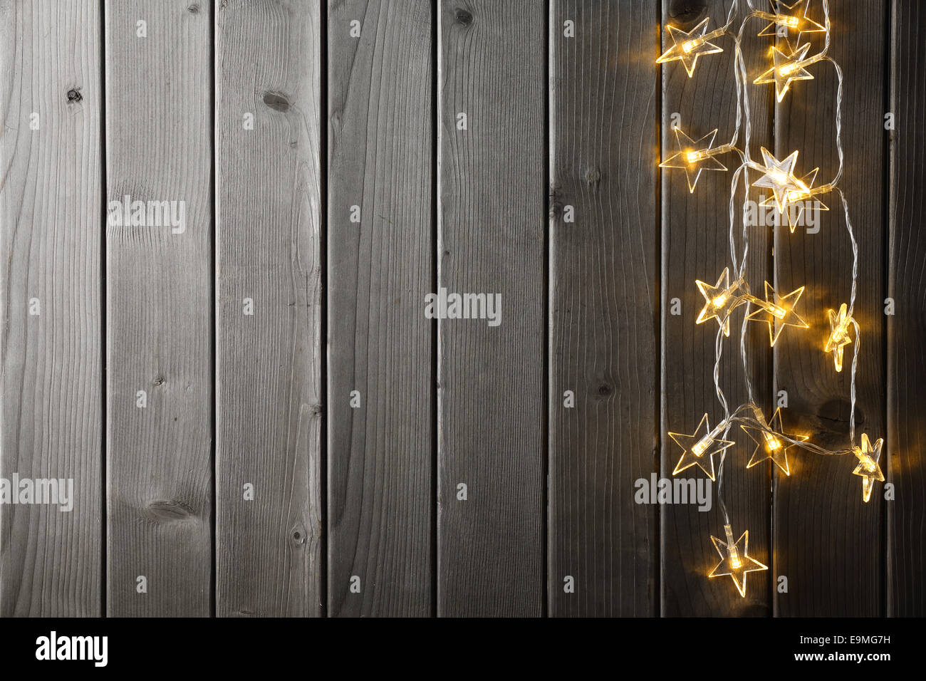 Christmas light on wood background Stock Photo