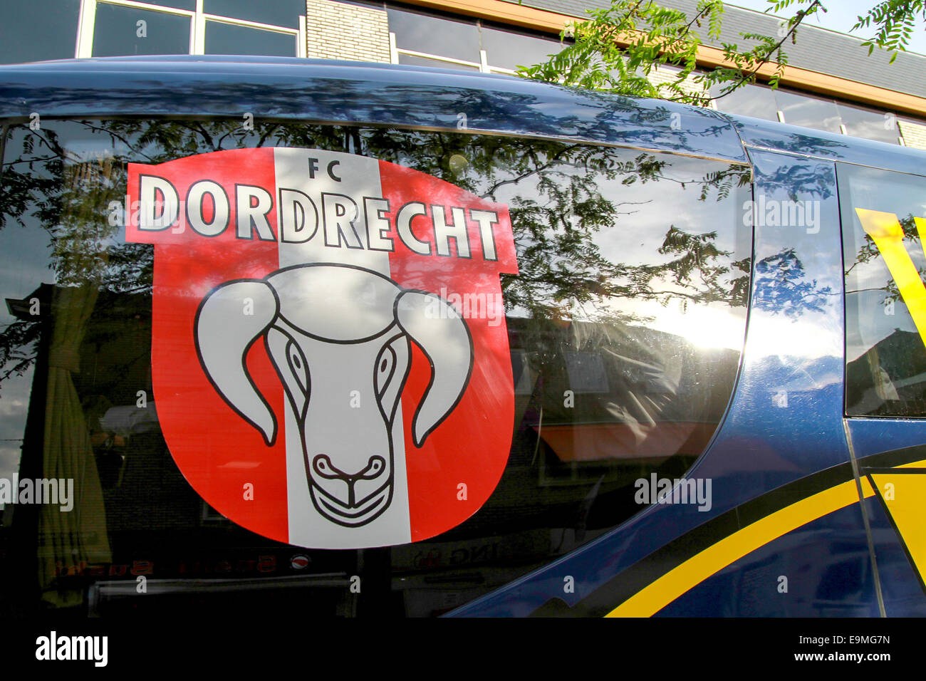 DORDRECHT, NETHERLANDS - MAY 20 2014: FC Dordrecht soccer players arriving in the players bus as fans cheer on to celebrate Stock Photo