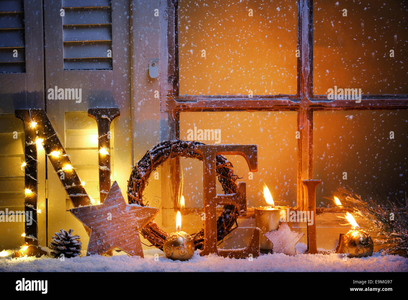 Frosted window with Christmas decoration Stock Photo