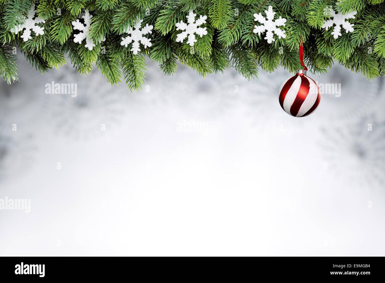 Christmas ball and snowflakes hanging on fir tree Stock Photo