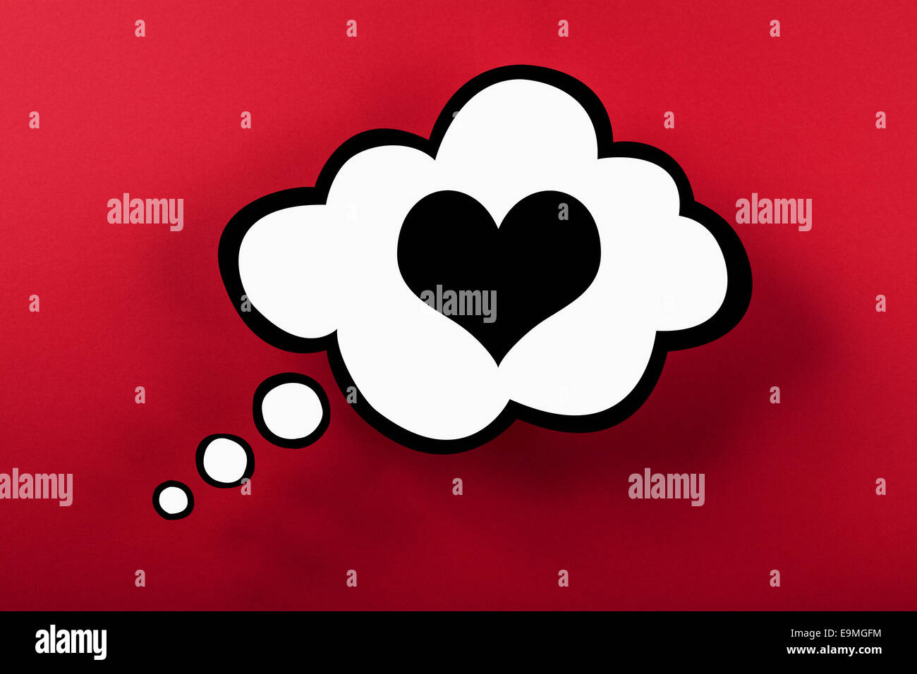 Heart thought bubble against red background Stock Photo