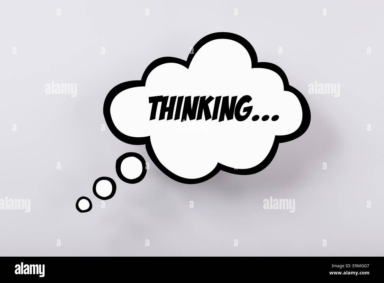 Thinking speech bubble against gray background Stock Photo