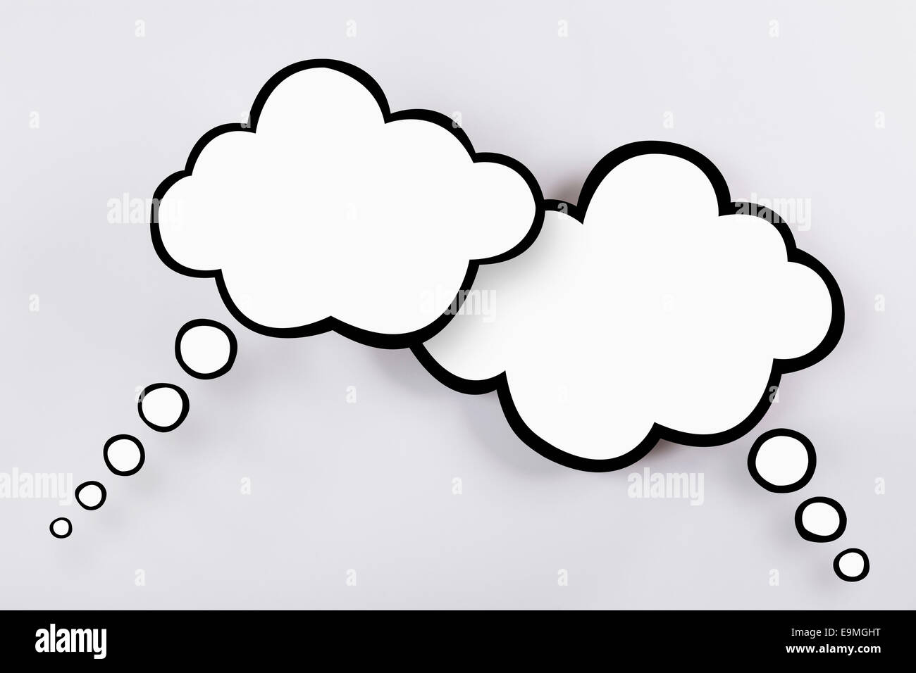 Blank thought bubbles against gray background Stock Photo