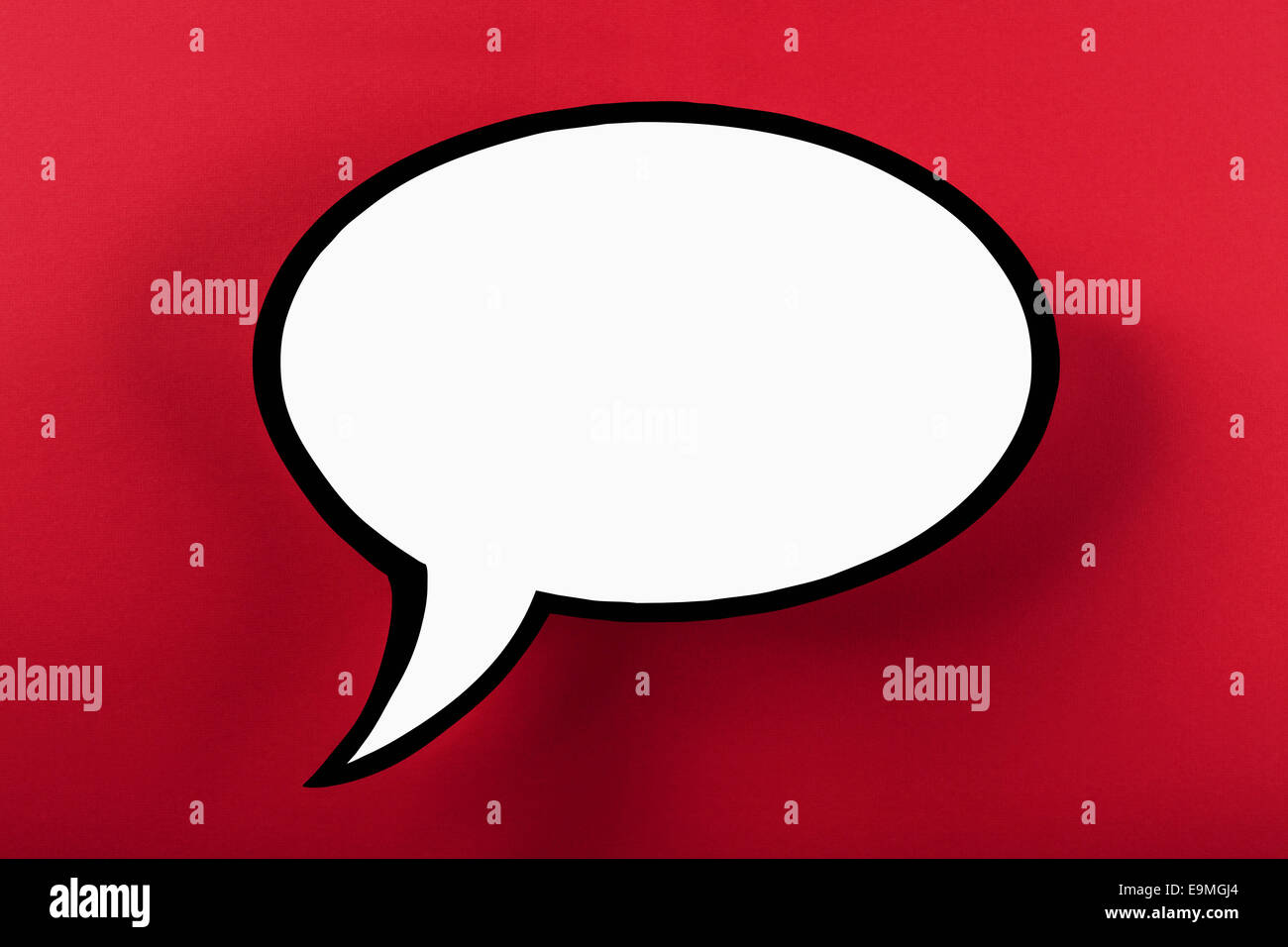 Blank speech bubble against red background Stock Photo - Alamy