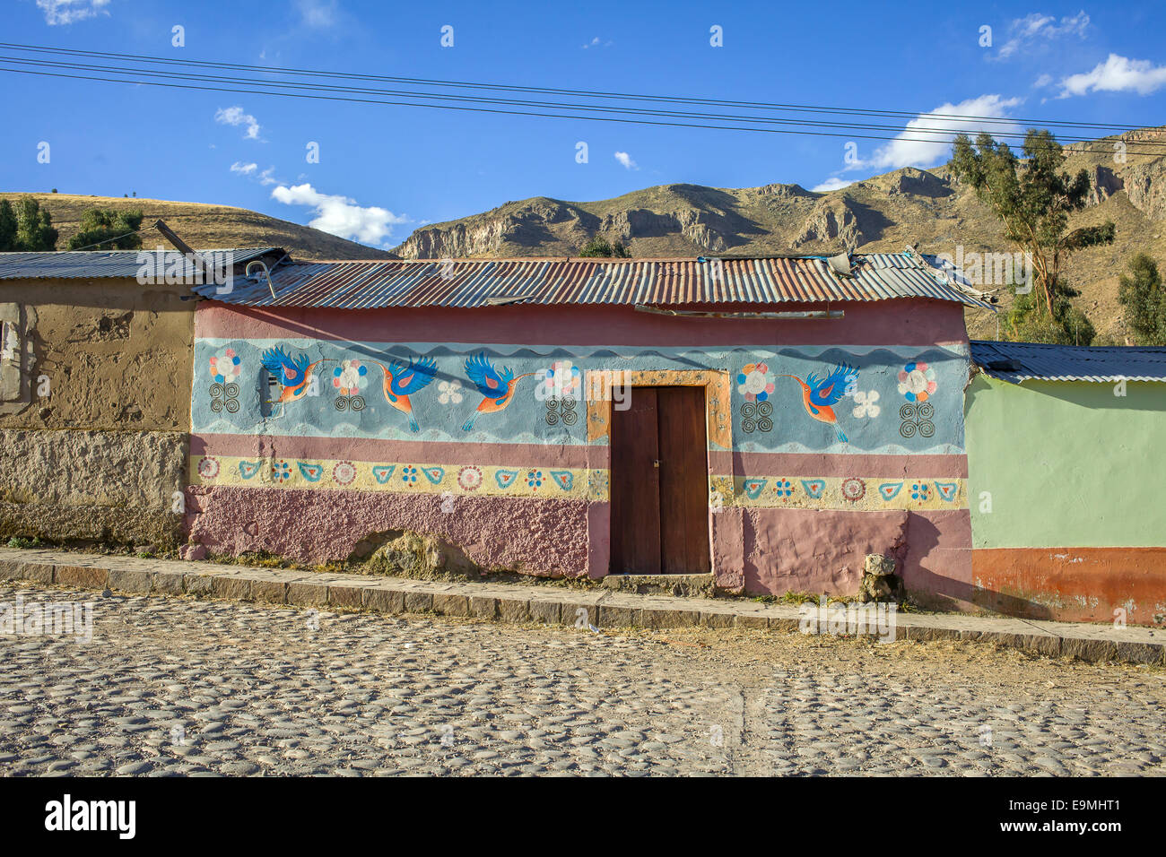 Colorful house with mural in Coporaque, Peru Stock Photo