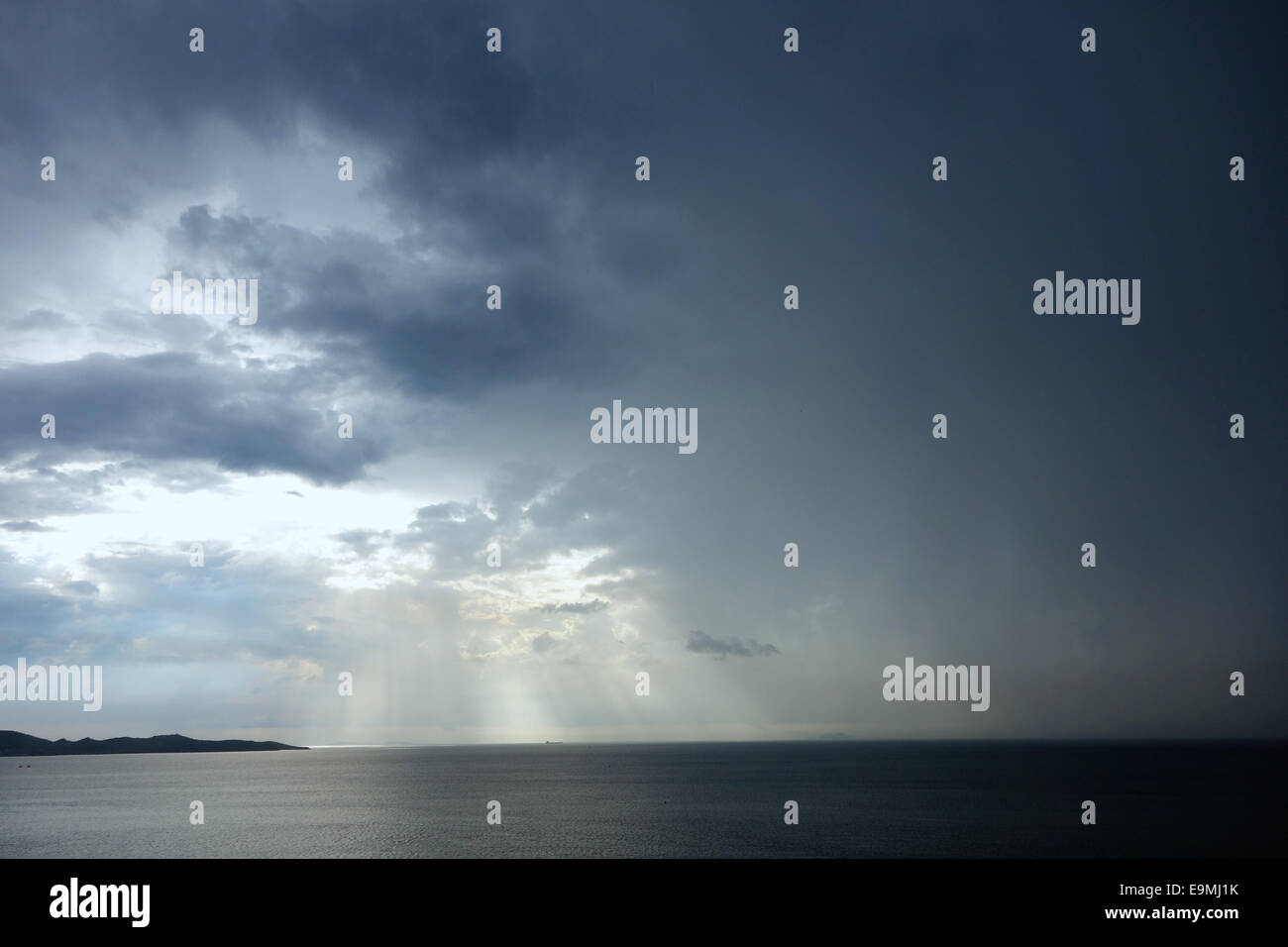 rainy sky with sun beams Stock Photo Alamy