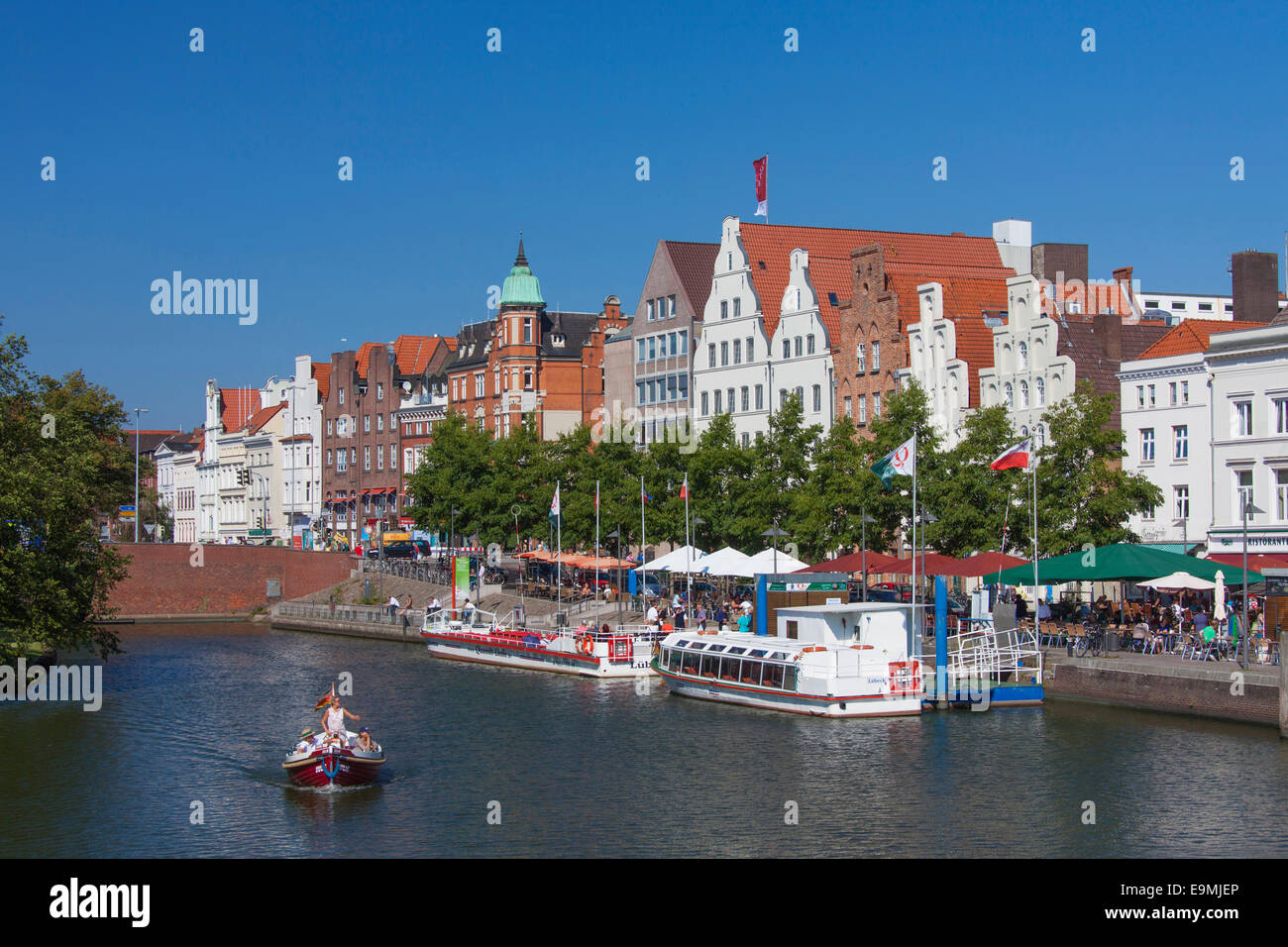 Houses sightseeing ships river Trave Luebeck Schleswig-Holstein Germany Stock Photo