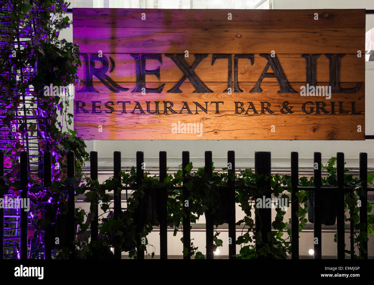 RexTail illuminated restaurant sign close up at night Stock Photo