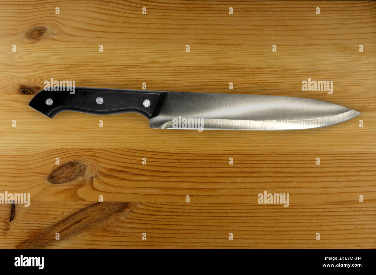 Knife on rustic kitchen table with copy space Stock Photo