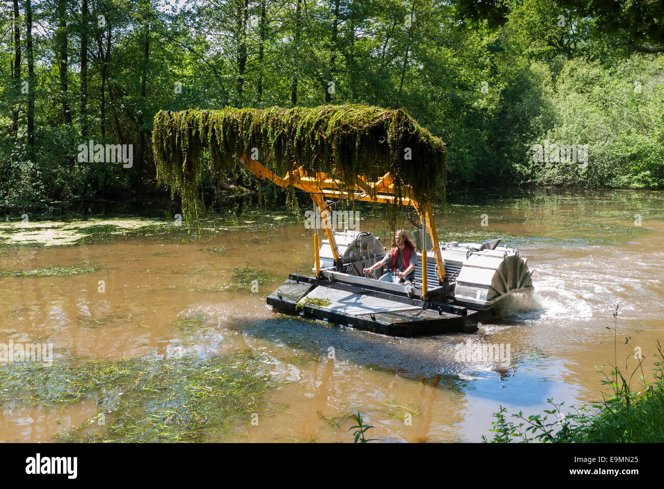 French waterway 'aquatic vegetation' Boat Clearing weed Stock Photo