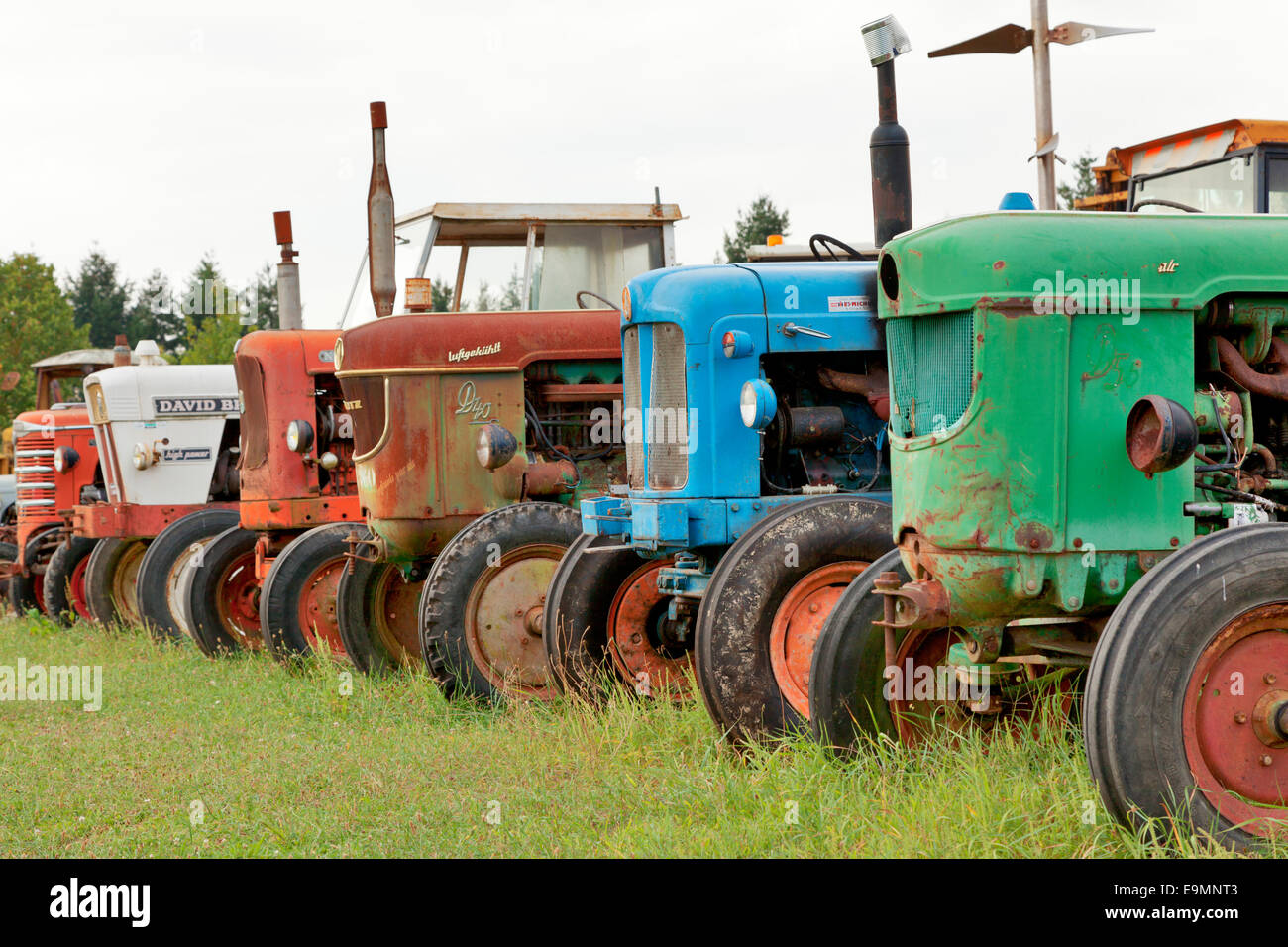 Row of old tractors in a field in France Stock Photo Alamy