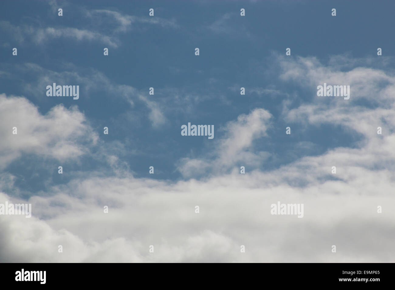 Background clear blue sky with fluffy white clouds Stock Photo