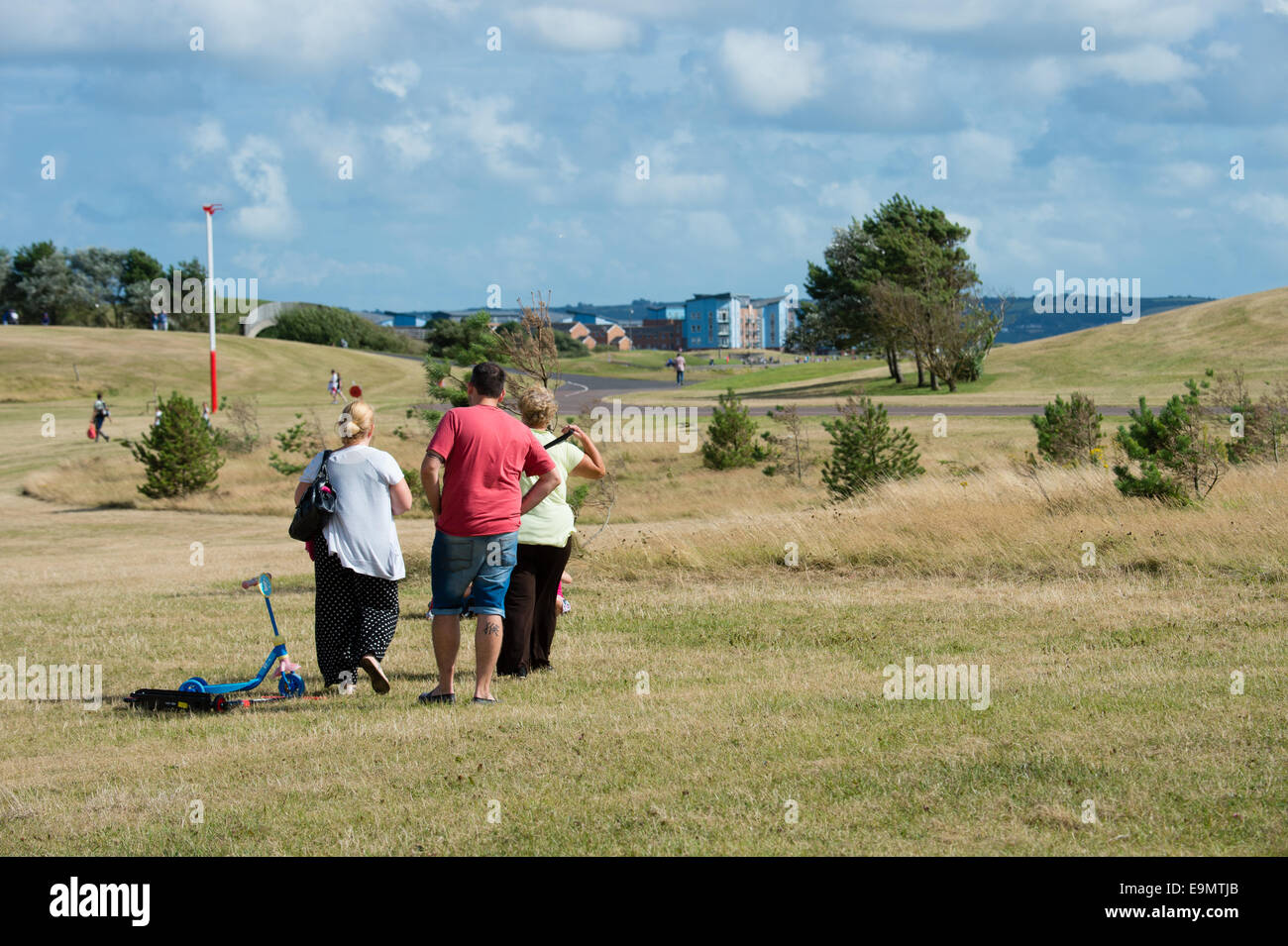 People walking in Llanelli Millennium park on a summer afternoon, Wales UK Stock Photo