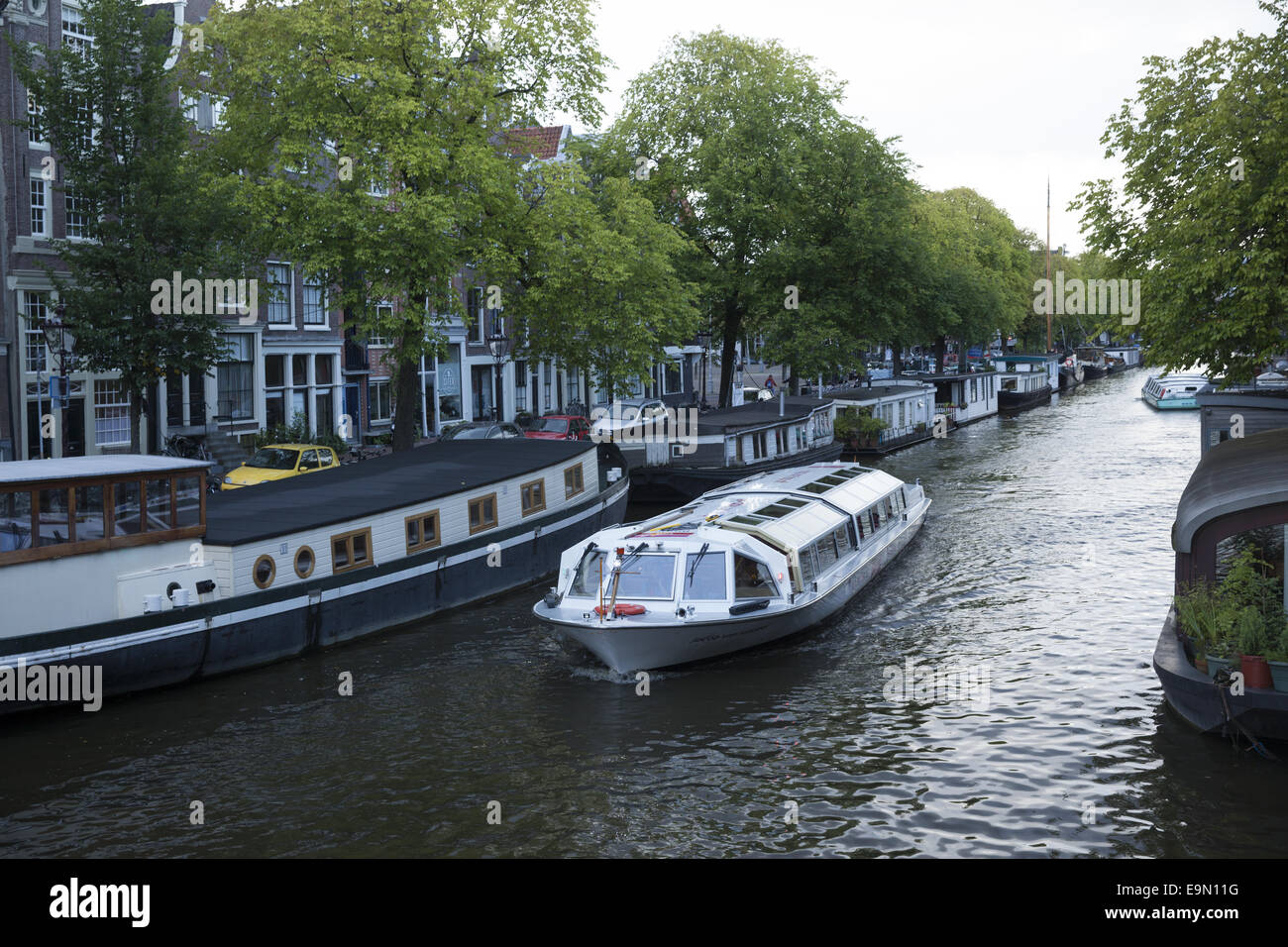 People literally live on the canals in Houseboats in Amsterdam, The Netherlands. Stock Photo