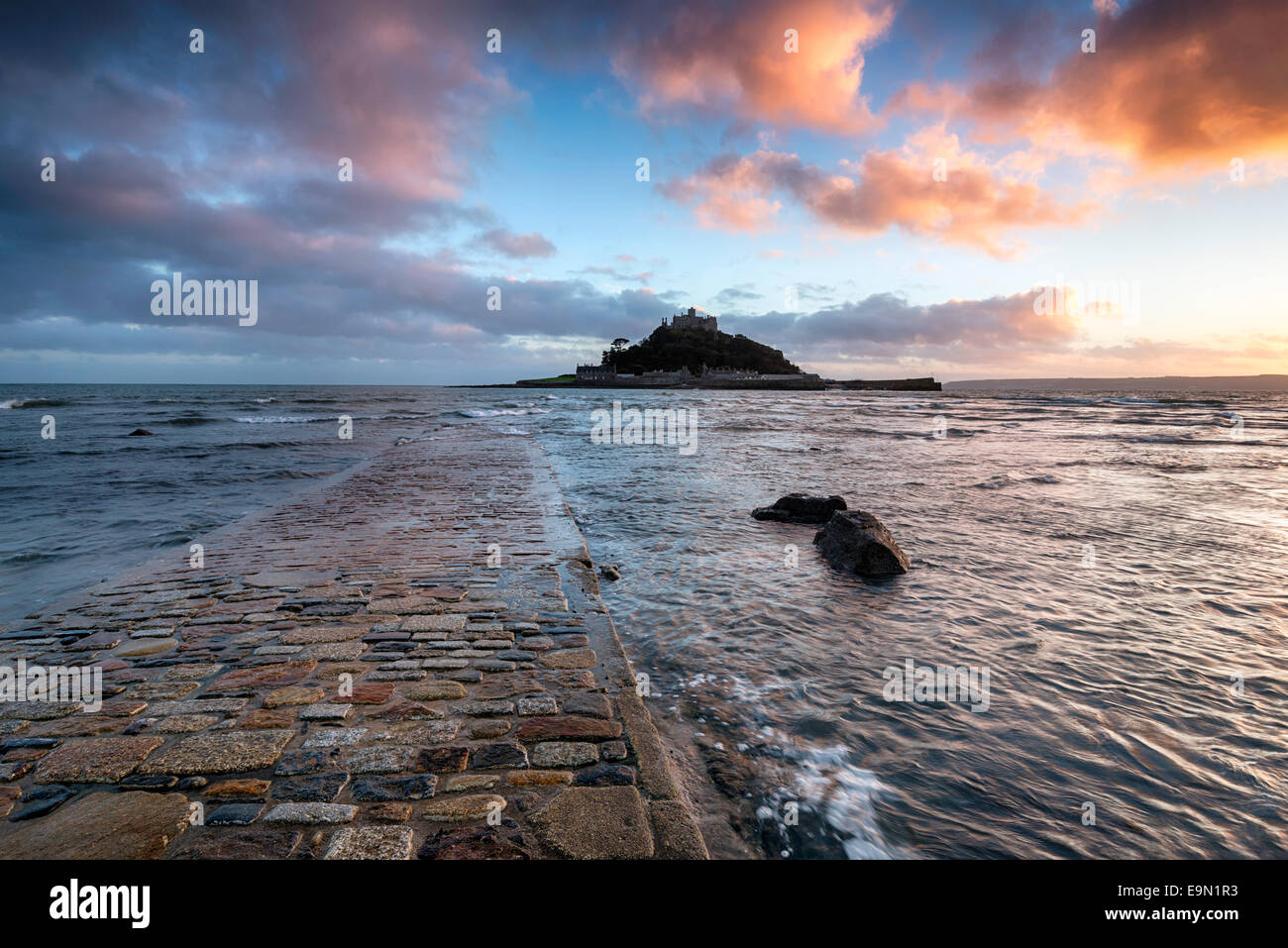 The causeway at high tide leading to St Michaels Mount at Marazion near Penzance in Cornwall Stock Photo