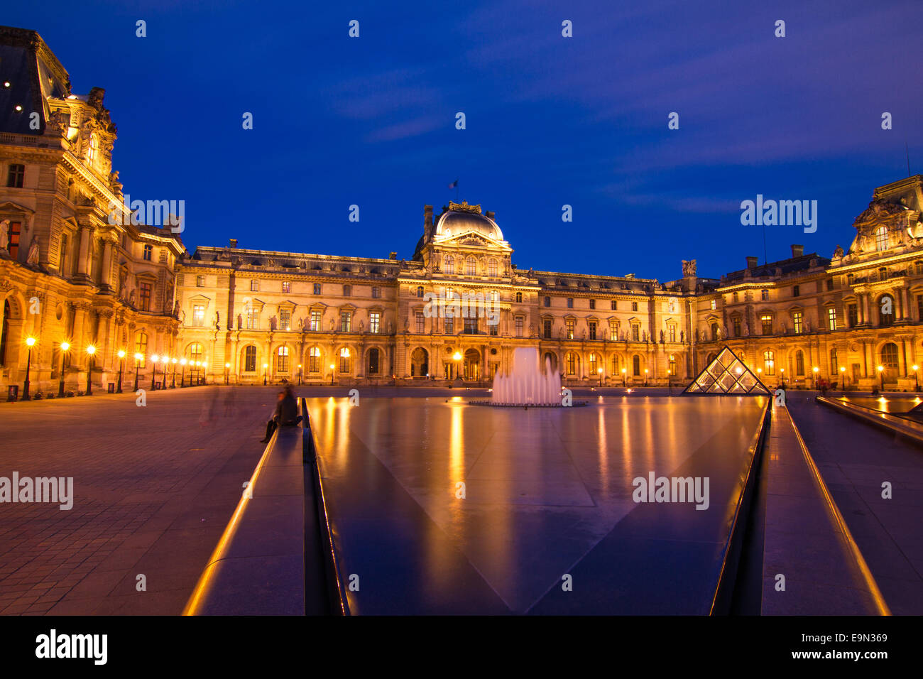 Louvre at Night in Paris Stock Photo