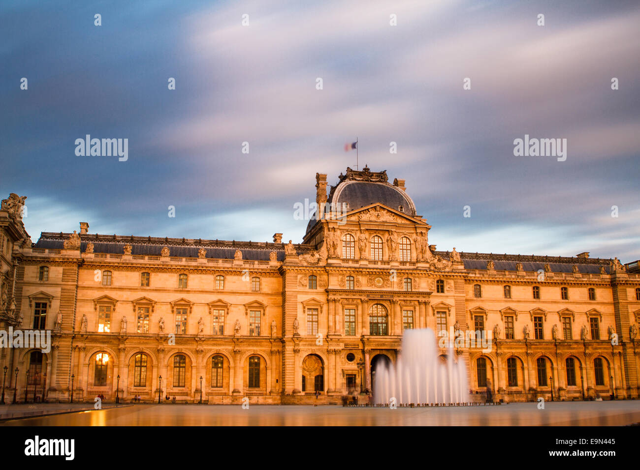 Louvre at sunset Stock Photo