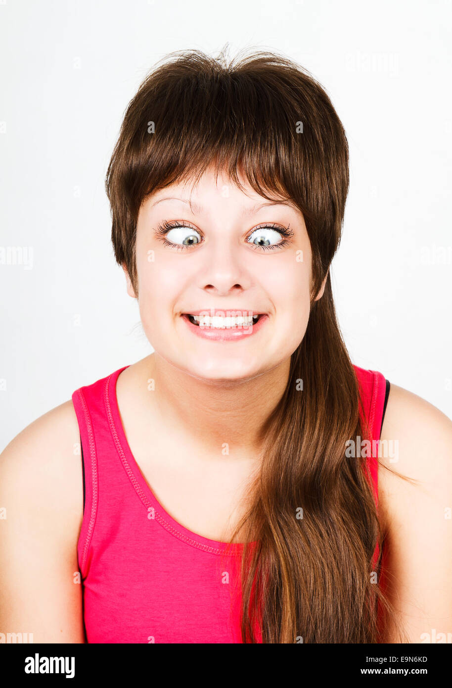 cross eyed squinting expression girl Stock Photo