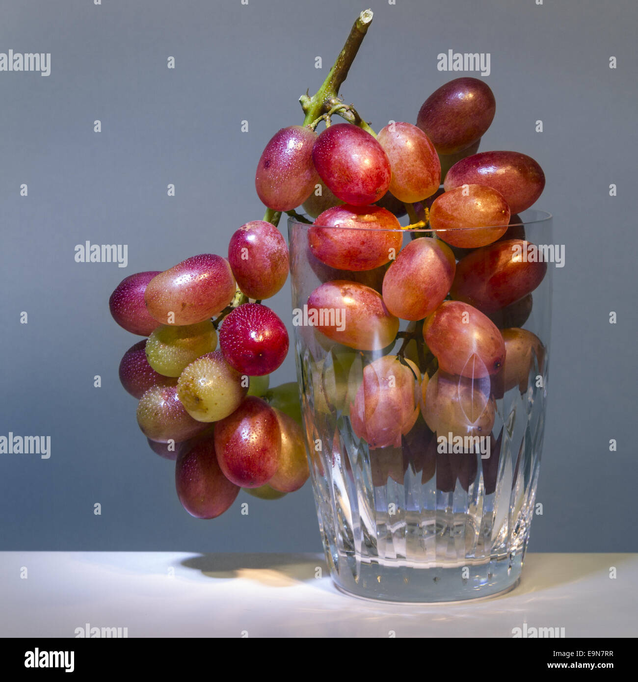 grapes in drinking glass Stock Photo