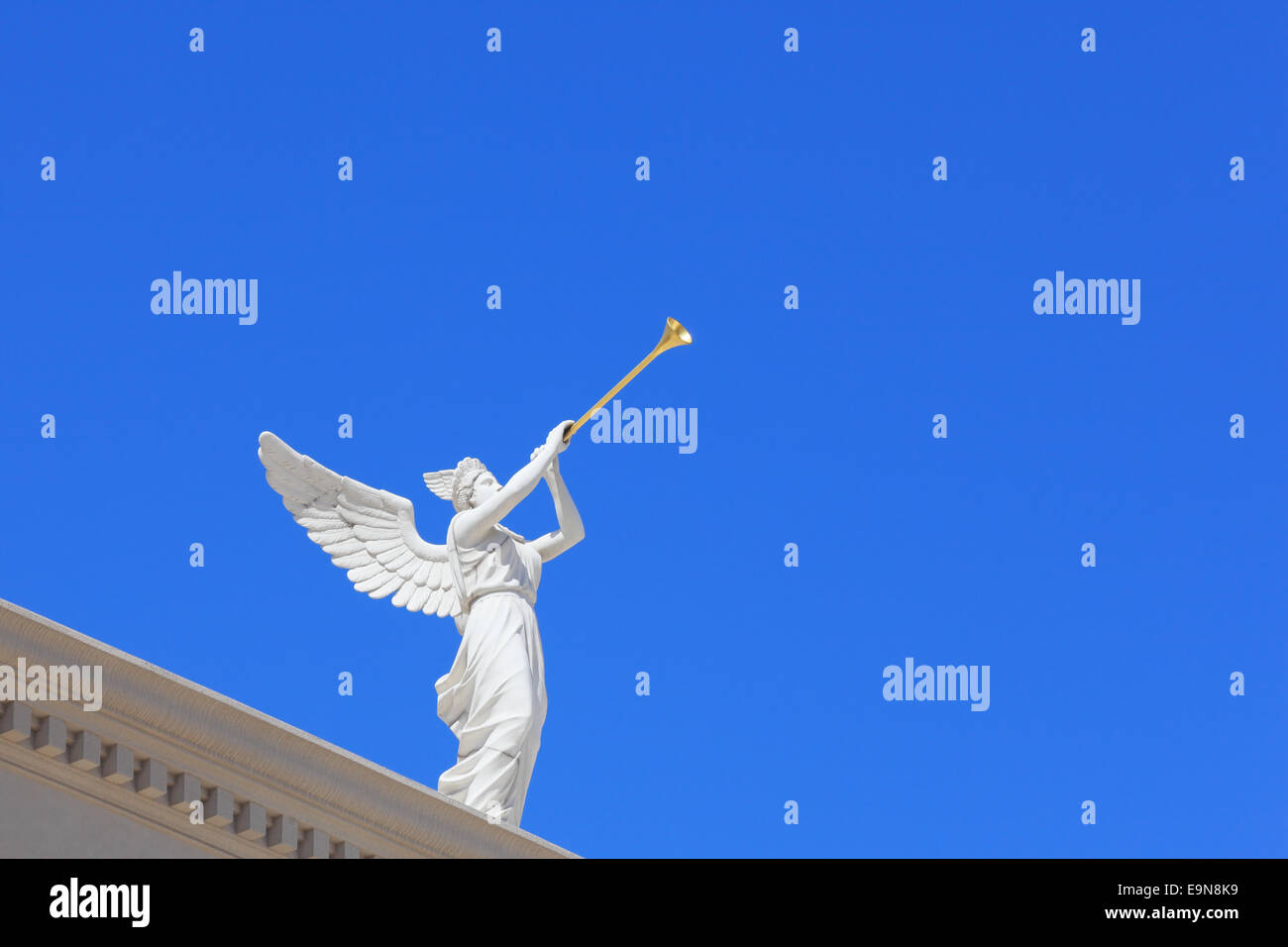 A white statue of a winged troubadour Stock Photo