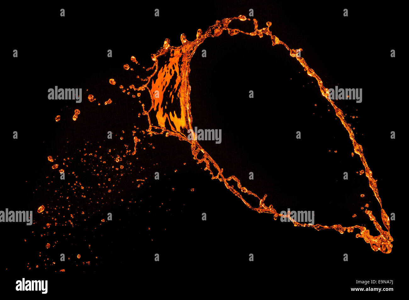 orange water splash isolated on black Stock Photo - Alamy