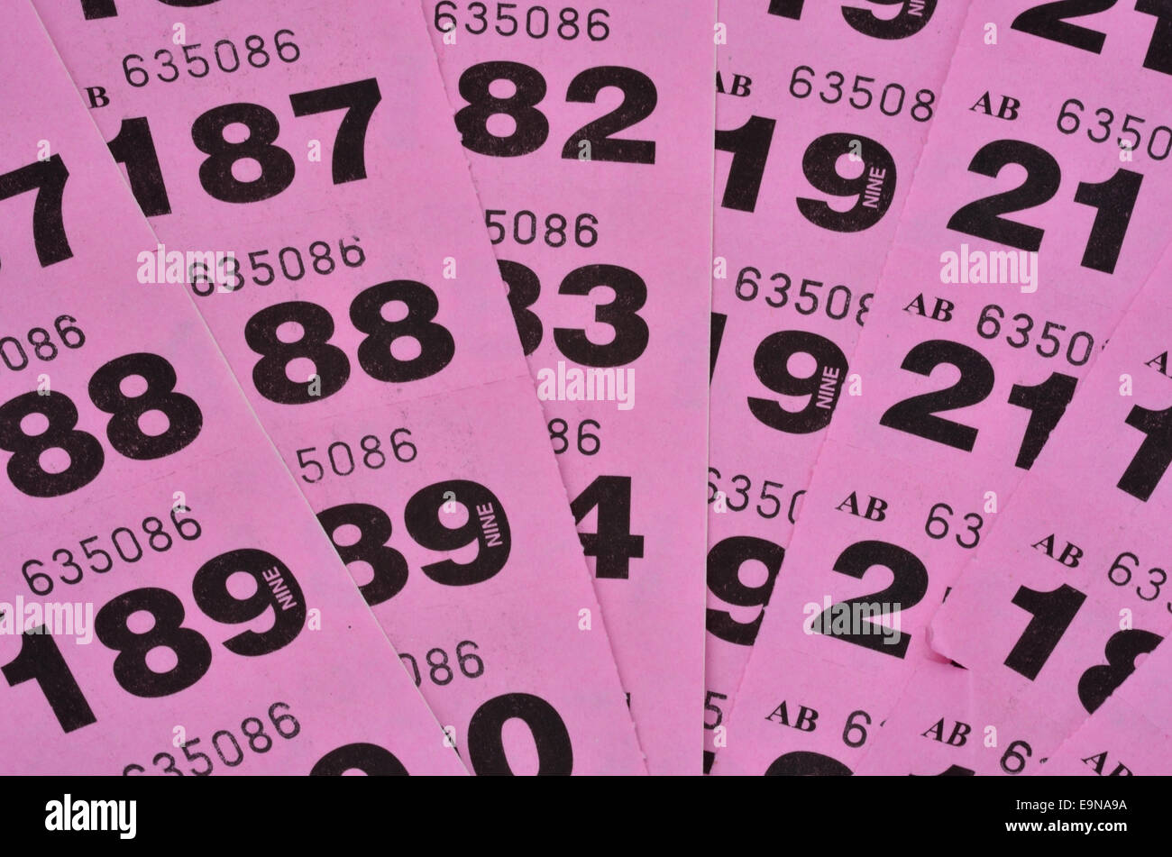Purple raffle tickets spread out Stock Photo - Alamy