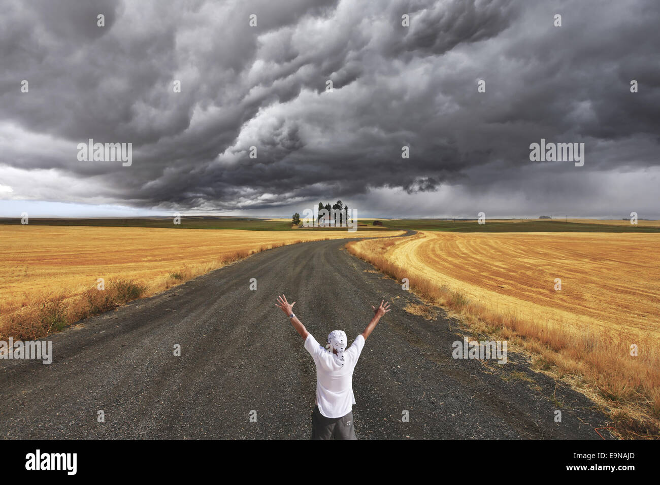 The enthusiastic tourist welcomes thunderstorm Stock Photo